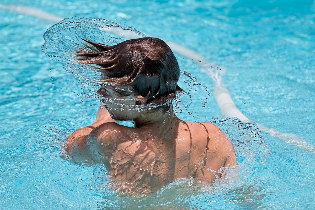 Swimming Pool Splash Swimmer  - stevepb / Pixabay