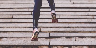 person climbing concrete stairs