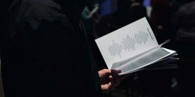 person standing while reading ook